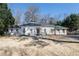 Charming brick home with manicured lawn and mature trees, creating a welcoming curb appeal at 139 W Paces Ferry Nw Rd, Atlanta, GA 30305