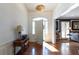 Inviting foyer with hardwood floors, arched window and a stylish light fixture, offering a warm welcome at 139 W Paces Ferry Nw Rd, Atlanta, GA 30305