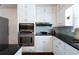 Modern kitchen with sleek countertops, stainless steel appliances, and custom white cabinets at 139 W Paces Ferry Nw Rd, Atlanta, GA 30305