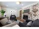 Spacious living room featuring a brick fireplace, hardwood floors, and comfortable seating, perfect for relaxation and entertainment at 139 W Paces Ferry Nw Rd, Atlanta, GA 30305