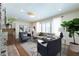 Bright living room with hardwood floors, modern decor, comfortable seating, and natural light streaming through the large window at 139 W Paces Ferry Nw Rd, Atlanta, GA 30305