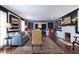 Spacious living room featuring hardwood floors and fireplace, with an open layout to the dining area at 139 W Paces Ferry Nw Rd, Atlanta, GA 30305