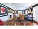 Elegant living room featuring hardwood floors, a fireplace, and refined decor with generous natural light at 139 W Paces Ferry Nw Rd, Atlanta, GA 30305