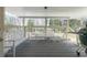 Covered porch with white furniture and a grill provides a shaded outdoor living space at 139 W Paces Ferry Nw Rd, Atlanta, GA 30305