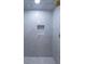 Close-up of a luxurious shower showcasing marble tile and a built-in shelf at 139 W Paces Ferry Nw Rd, Atlanta, GA 30305