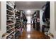 Spacious walk-in closet with custom shelving, hanging racks, and ample storage space for shoes, clothing, and accessories at 139 W Paces Ferry Nw Rd, Atlanta, GA 30305