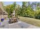Serene outdoor patio and spacious yard, perfect for outdoor entertaining and relaxation at 5780 Heards Forest Dr, Atlanta, GA 30328