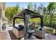 Relaxing covered outdoor lounge area with comfortable seating, perfect for entertaining guests at 5780 Heards Forest Dr, Atlanta, GA 30328