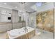 Lavish bathroom boasts a glass shower, soaking tub, and dual vanities with great lighting at 5780 Heards Forest Dr, Atlanta, GA 30328