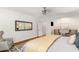 Bright bedroom boasts hardwood floors, neutral decor, and an ensuite bathroom at 5780 Heards Forest Dr, Atlanta, GA 30328