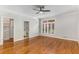 Bedroom featuring hardwood floors, a large window and access to a walk-in closet and bathroom at 5780 Heards Forest Dr, Atlanta, GA 30328
