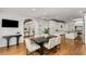 Open floor plan dining room next to a modern, gourmet kitchen and bright living room at 5780 Heards Forest Dr, Atlanta, GA 30328