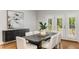 Modern dining room features a stylish table, seating for six, and natural light at 5780 Heards Forest Dr, Atlanta, GA 30328