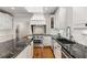 Stylish kitchen features granite countertops, stainless steel appliances, and white cabinetry at 5780 Heards Forest Dr, Atlanta, GA 30328