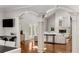 Bright living room with vaulted ceiling, skylights, fireplace, and hardwood floors at 5780 Heards Forest Dr, Atlanta, GA 30328