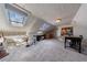 Bright attic space with skylights, carpeted flooring, and creative work areas at 6 Lullwater Ne Est, Atlanta, GA 30307