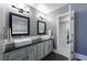 Modern bathroom with dual sinks, granite countertops, and stylish fixtures, offering a luxurious experience at 6 Lullwater Ne Est, Atlanta, GA 30307