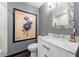 Stylish bathroom featuring a modern vanity, decorative mirror, and unique wall art at 6 Lullwater Ne Est, Atlanta, GA 30307
