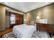 Cozy bedroom featuring an antique armoire, dresser, and hardwood floors at 6 Lullwater Ne Est, Atlanta, GA 30307