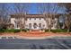 Stately two-story home with a circular driveway and manicured landscaping at 6 Lullwater Ne Est, Atlanta, GA 30307