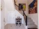 Inviting entryway with tiled floor, staircase, and decorative artwork at 6 Lullwater Ne Est, Atlanta, GA 30307