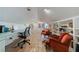 Spacious home office with terracotta tile, built-in shelving, and ample workspace at 6 Lullwater Ne Est, Atlanta, GA 30307