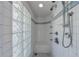 White tiled shower showcasing multiple shower heads and sleek fixtures at 6 Lullwater Ne Est, Atlanta, GA 30307