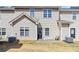 Back exterior of home with door to small yard and a patio at 69 Eagle Glen Dr, Cartersville, GA 30121