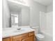 Bathroom featuring a wood vanity, a large mirror, and a shower-tub combo at 69 Eagle Glen Dr, Cartersville, GA 30121