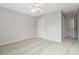 Neutral bedroom with a ceiling fan and neutral carpet at 69 Eagle Glen Dr, Cartersville, GA 30121