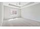 Light-filled bedroom features a large window and neutral carpeting at 69 Eagle Glen Dr, Cartersville, GA 30121