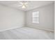 Bright bedroom with a ceiling fan and neutral carpeting at 69 Eagle Glen Dr, Cartersville, GA 30121