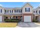 Charming townhome with brick accents, tidy landscaping, and a convenient attached garage at 69 Eagle Glen Dr, Cartersville, GA 30121