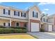 Inviting two-story townhome featuring a brick facade and a one-car attached garage at 69 Eagle Glen Dr, Cartersville, GA 30121