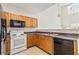 Kitchen featuring wooden cabinetry and ample counter space at 69 Eagle Glen Dr, Cartersville, GA 30121