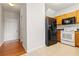 Efficient kitchen with wood cabinets and white appliances at 69 Eagle Glen Dr, Cartersville, GA 30121