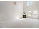 Bright living room with a cozy fireplace and soaring ceilings at 69 Eagle Glen Dr, Cartersville, GA 30121