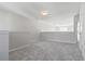 Large upstairs loft area with neutral walls and carpet at 69 Eagle Glen Dr, Cartersville, GA 30121