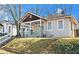 Cozy home featuring a covered front porch and mature trees in a peaceful neighborhood at 135 Adair Se Ave, Atlanta, GA 30315