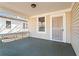 Inviting front porch featuring a secure entry door and a view of the neighborhood at 135 Adair Se Ave, Atlanta, GA 30315