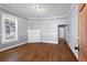 Bright living room with hardwood floors, fireplace, and large window for natural light at 135 Adair Se Ave, Atlanta, GA 30315