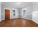 Elegant living room with wood floors, crown molding, and decorative fireplace at 135 Adair Se Ave, Atlanta, GA 30315