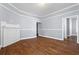 Spacious living room with polished wood floors, neutral walls, and classic architectural details at 135 Adair Se Ave, Atlanta, GA 30315
