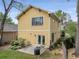 Inviting backyard showcases a two-story home with a charming patio and manicured landscaping at 357 Murray Hill Ne Ave, Atlanta, GA 30317