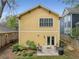 Inviting backyard showcases a two-story home with a charming patio and manicured landscaping at 357 Murray Hill Ne Ave, Atlanta, GA 30317