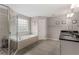 Bathroom featuring a separate glass shower and a soaking tub at 357 Murray Hill Ne Ave, Atlanta, GA 30317