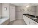 Bright bathroom boasts double sinks, granite countertops, and a soaking tub at 357 Murray Hill Ne Ave, Atlanta, GA 30317