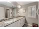 Bathroom featuring a large mirror over the double sink granite countertop at 357 Murray Hill Ne Ave, Atlanta, GA 30317