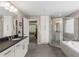 Bathroom featuring a walk-in shower, soaking tub, and double sink vanity at 357 Murray Hill Ne Ave, Atlanta, GA 30317