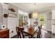 This dining area is next to a window and door leading outside, next to the kitchen at 357 Murray Hill Ne Ave, Atlanta, GA 30317